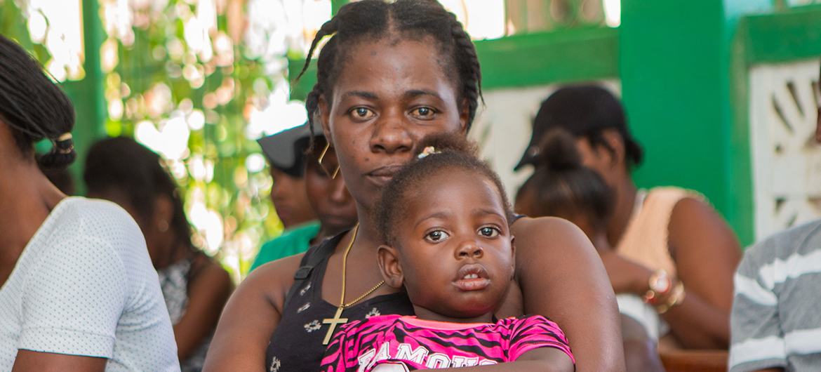 Mothers wait with their children to be vaccinated at a UNFPA-suppoted hospital in southern Haiti. Mothers wait with their children to be vaccinated at a UNFPA-suppoted hospital in southern Haiti.
